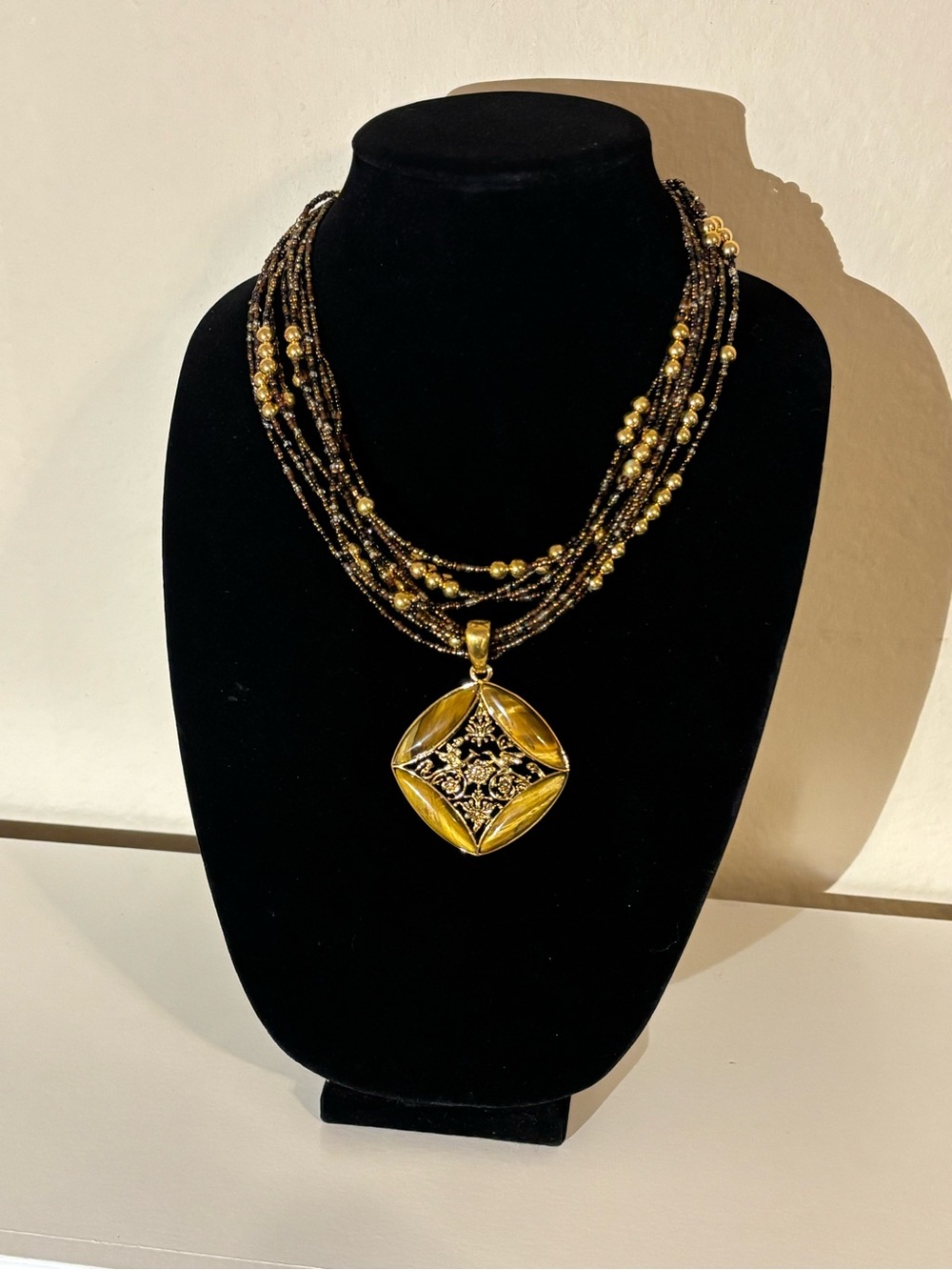 Joan Rivers Gold and Black Multi-Strand Necklace with Ornate Pendant